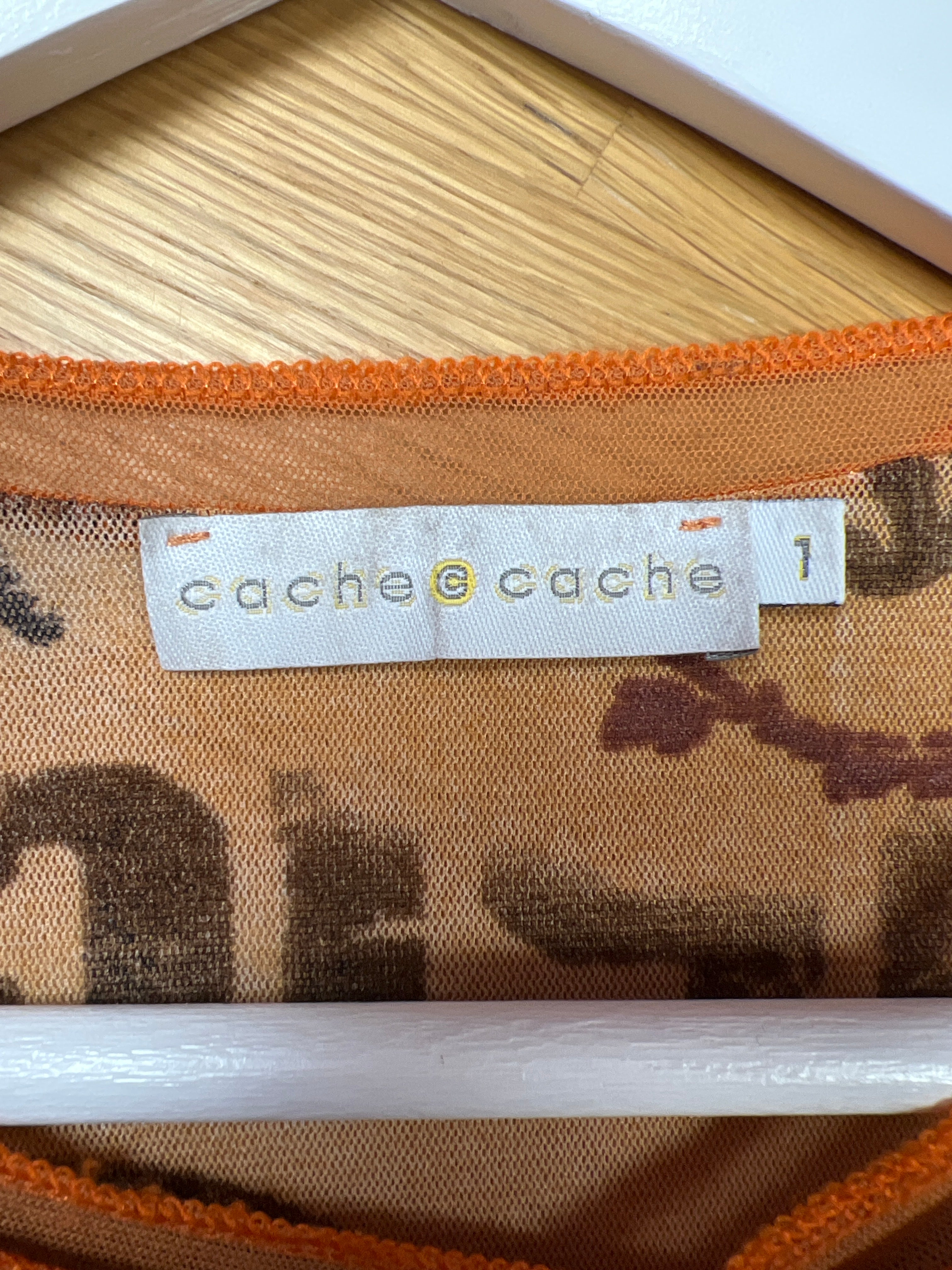 Y2K-inspirerad orange mönstrad topp cache cache