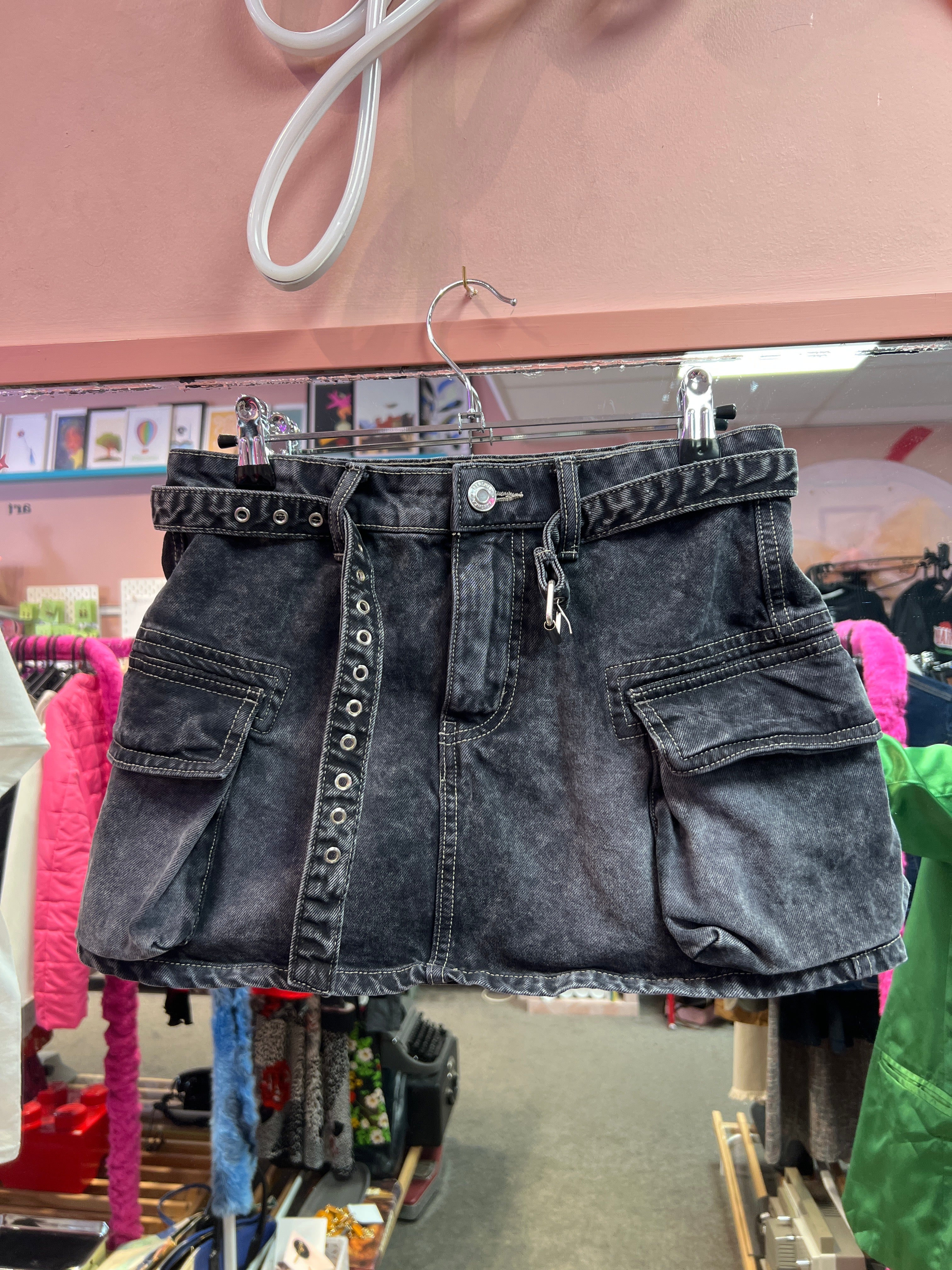 Black mini skirt with belt and side pockets