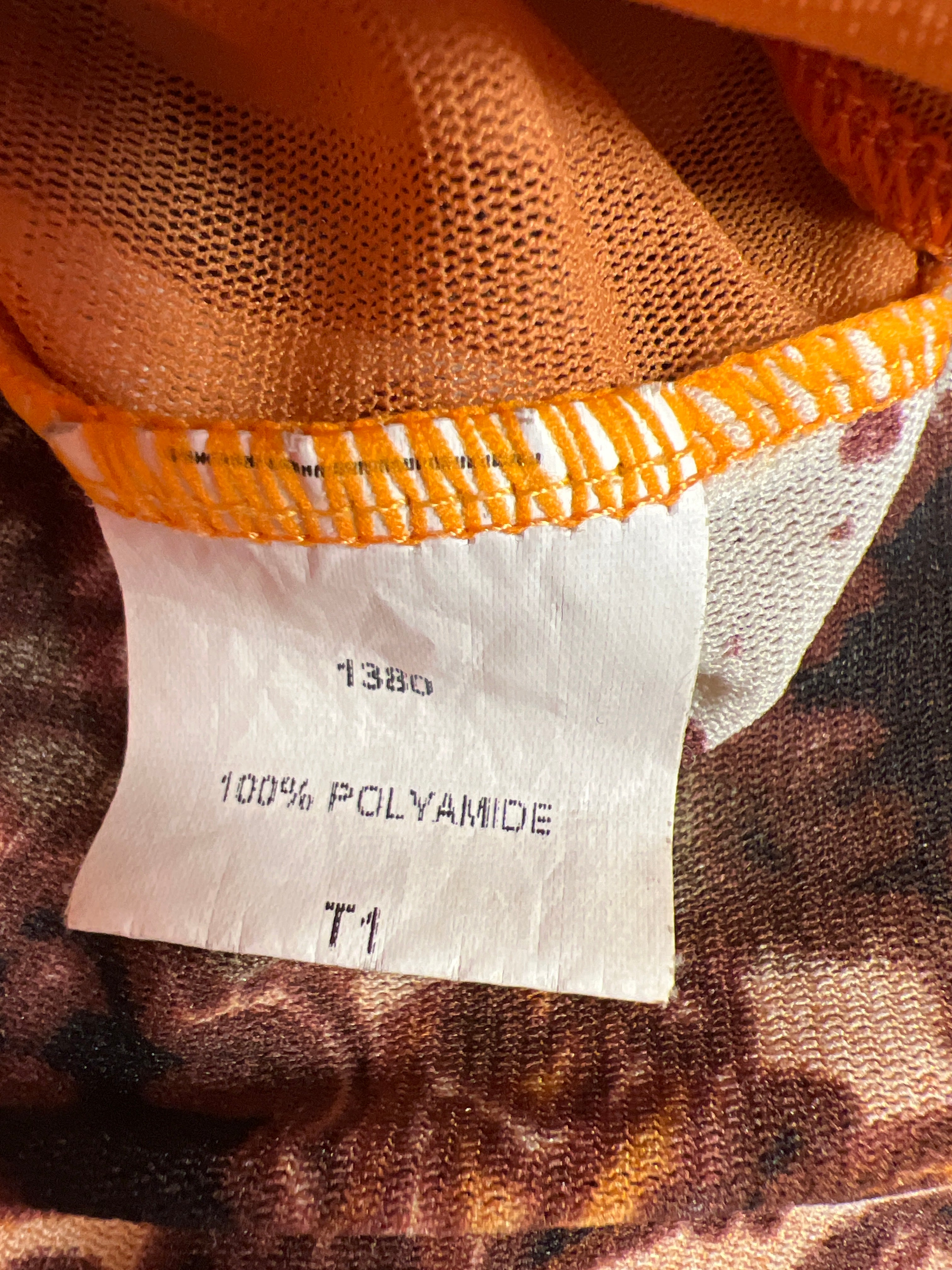 Y2K-inspirerad orange mönstrad topp cache cache